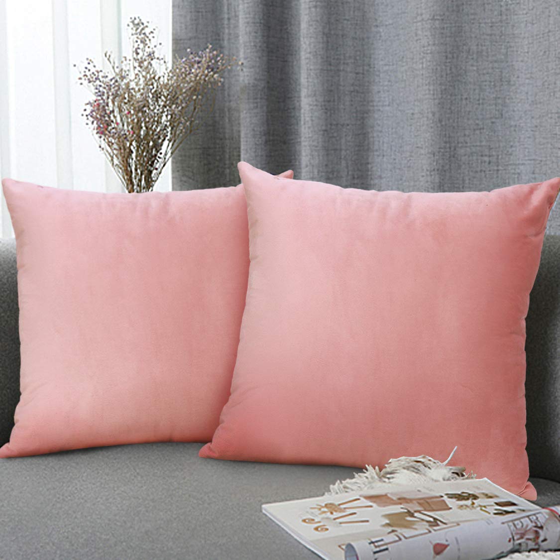 two pink velvet square pillow covers