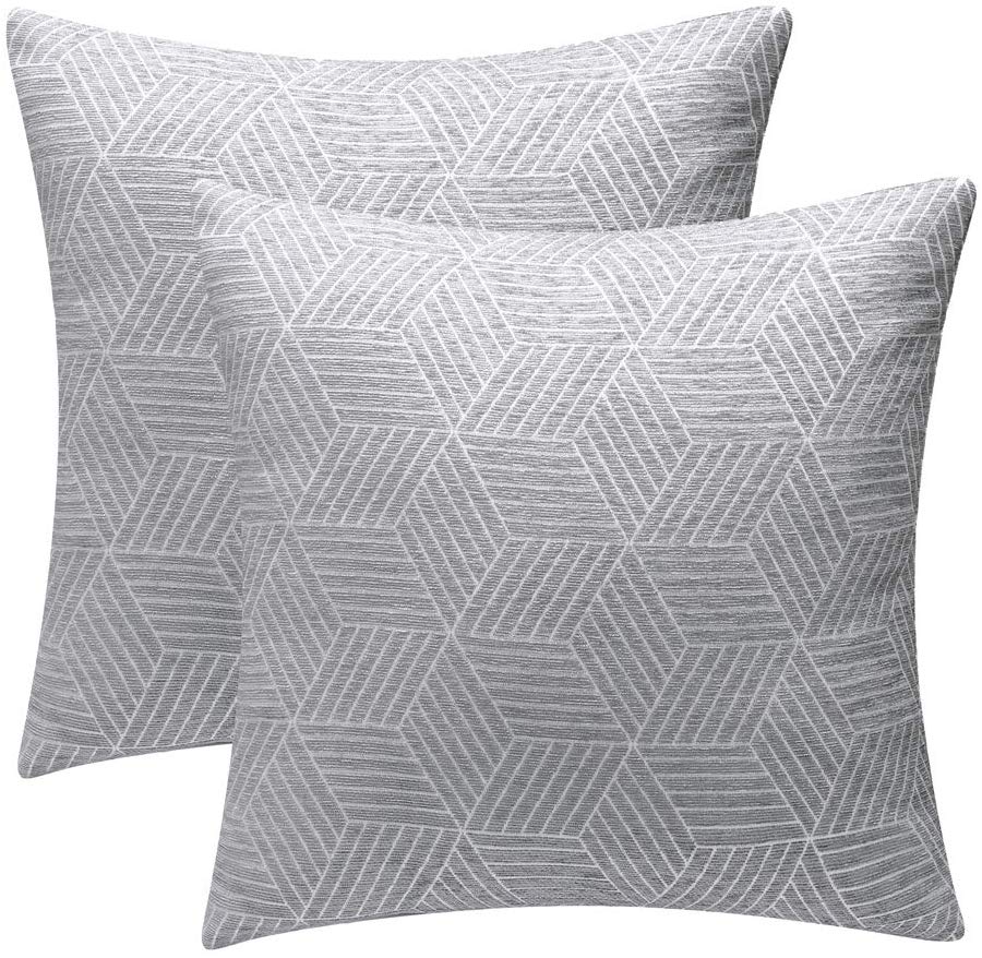two square gray pillow covers with white geometric shapes