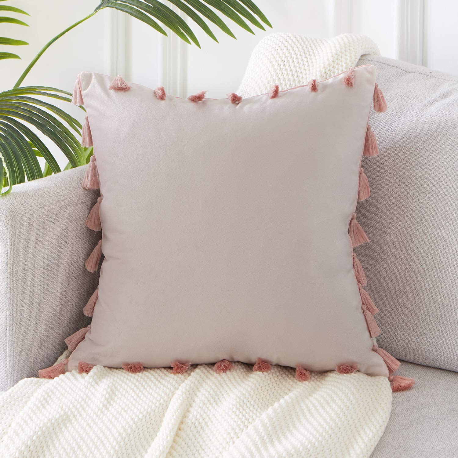 modern pink square pillow case with pink tassels all around