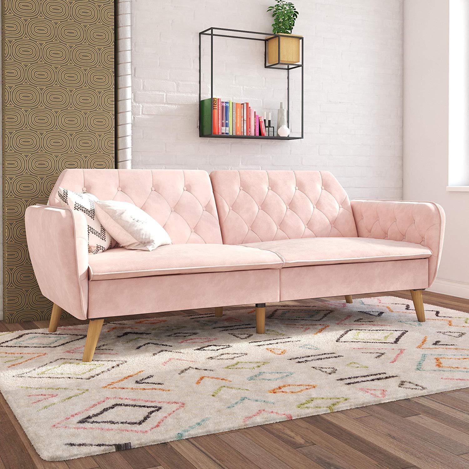 pink velvet futon with wooden legs