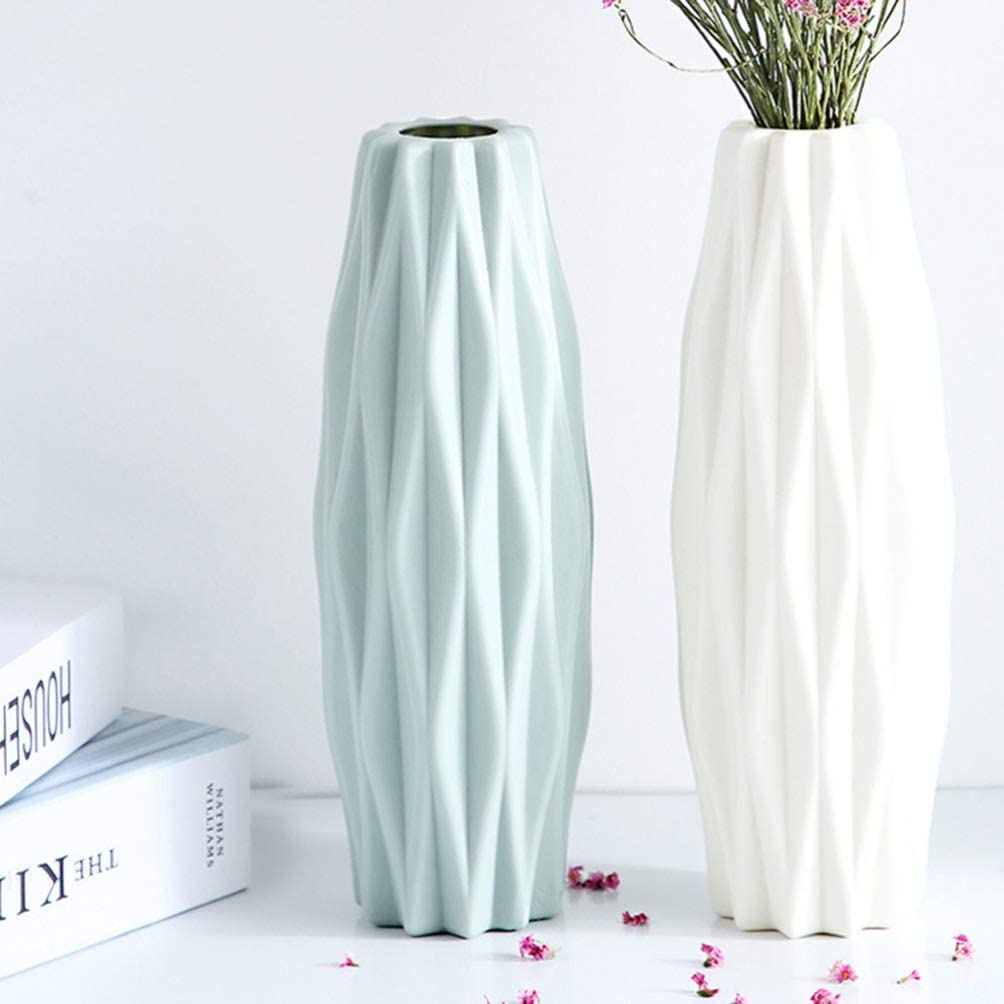 tall light green vase with intriquate designs