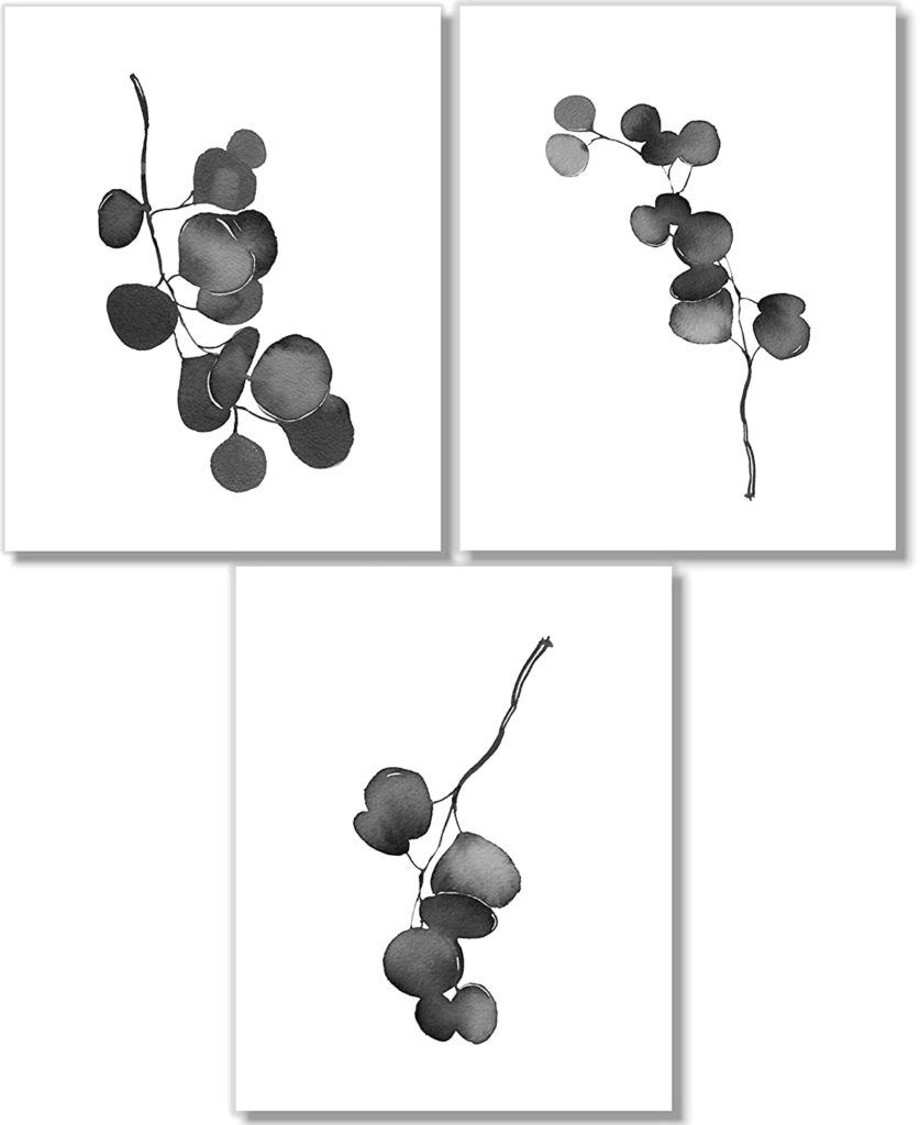 three simple modern wall graphics of plants