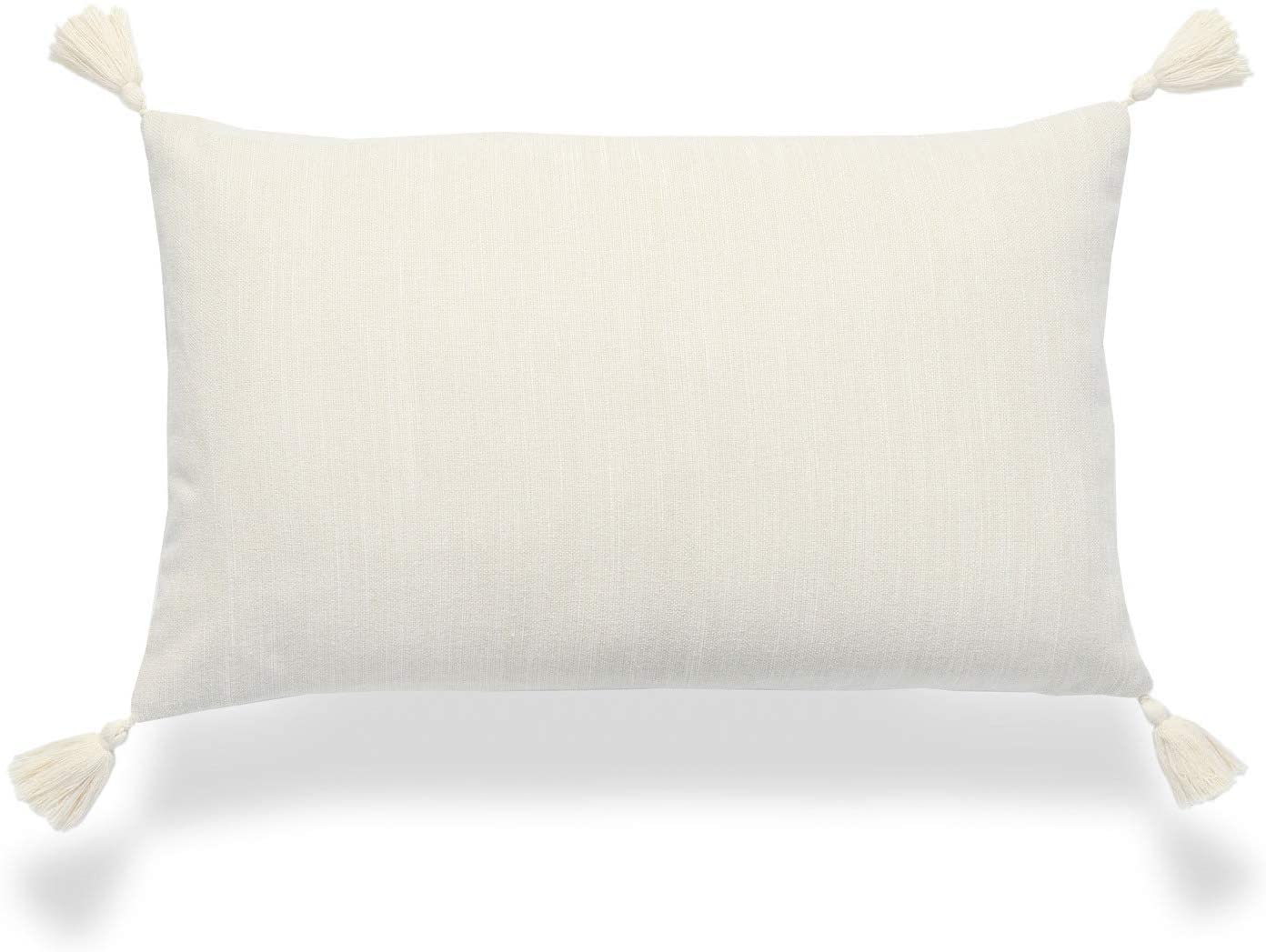 beige lumbar pillow with tassels