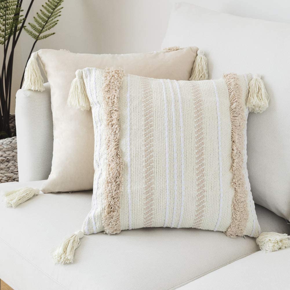 white and beige boho pillow set with tassels
